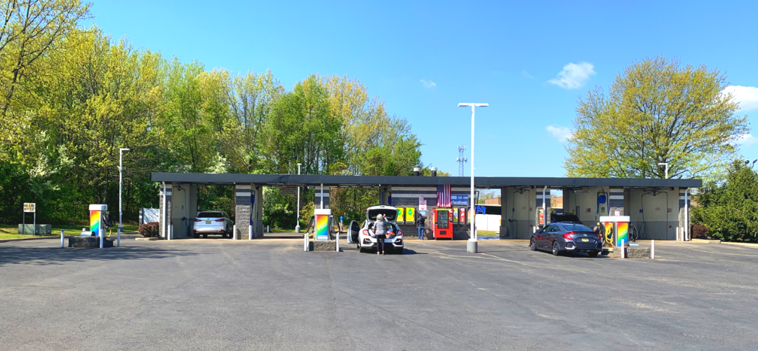 Panoramic view of Sudzy Car Wash bays in Delran, NJ on a sunny day